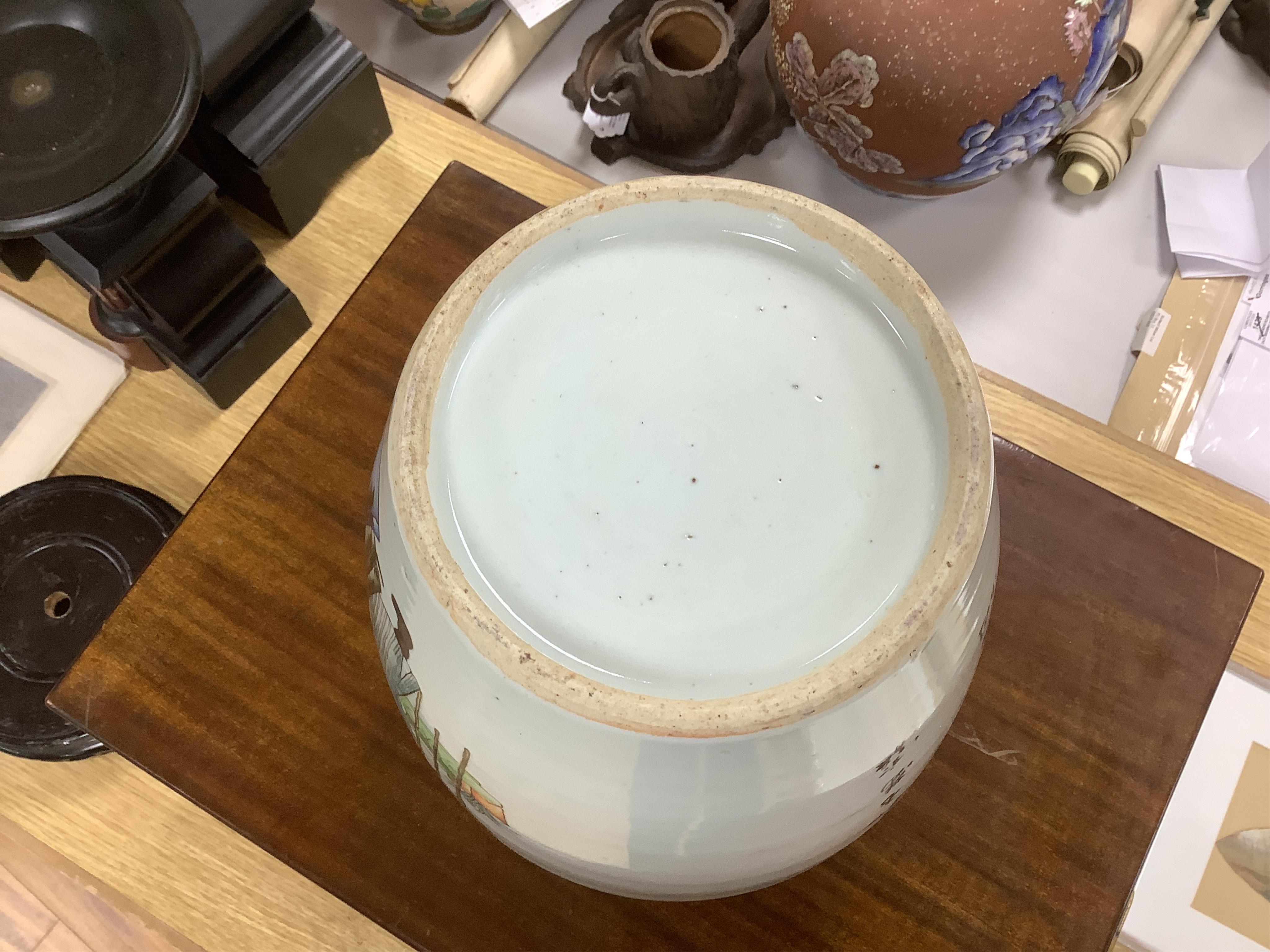An early 20th century Chinese famille rose jar and cover on stand., 33cm high not including stand. Condition - good